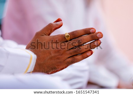 Traditional indian wedding ceremony, groom  hand in wedding process 