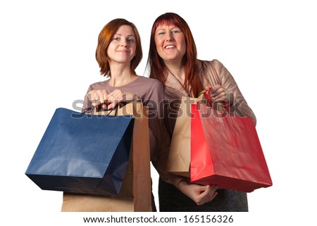 Happy young women after shopping isolated on white..
