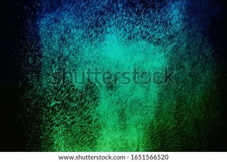 color powder explosion cloud isolated on black background. Freeze motion of color dust particles splashing. 
