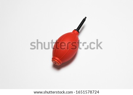 A Dust Blower Mock up on a white background. It's used for cleaning camera lenses or computer equipment.High resolution photo.Top view.