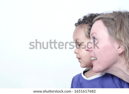 mother and child looking to the side with white background stock photo 