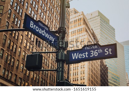 Manhattan NYC buildings, road signs on west 36nd street and Broadway, 