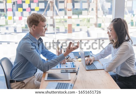 Business people, a group of business people are talking to analyze excellent business data in a modern office, the concept of teamwork.