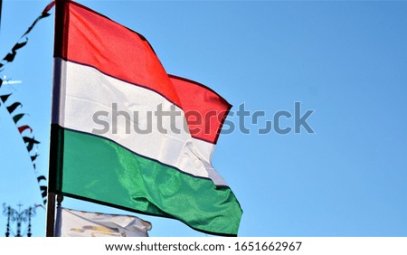 Hungarian flag against the clear blue sky