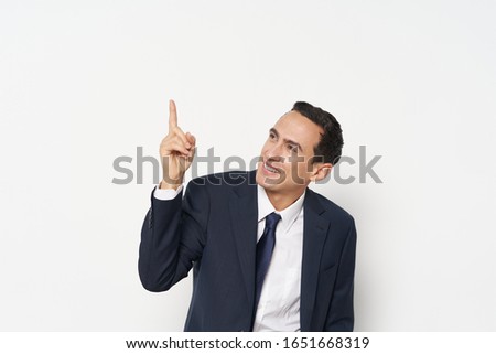 business man shows thumb up and classic suit