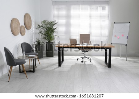 Director's office with large wooden table. Interior design Royalty-Free Stock Photo #1651681207