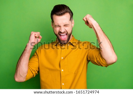Close-up portrait of his he nice attractive cheerful cheery ecstatic guy in formal shirt celebrating great luck triumph isolated on bright vivid shine vibrant green color background