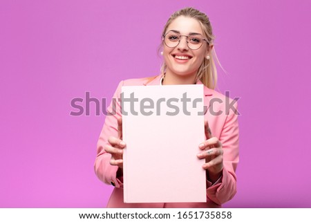young pretty blonde woman holding books
