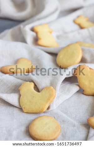 Easter cookies on a grey linen napkin. Homemade butter and sugar cookies.