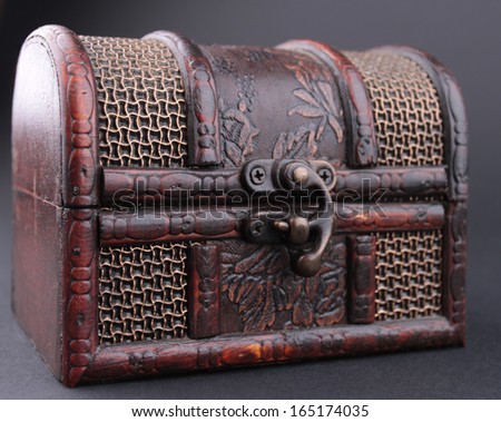 Wooden chest on a black background.