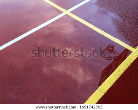 Basket reflection on wet court