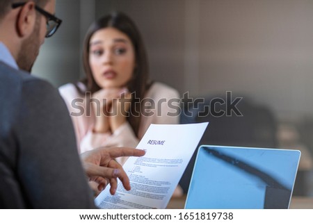 Nervous young job applicant wait for recruiters question during interview in office, worried intern or trainee feel stressed applying for open position, meeting with hr managers. Hiring concept