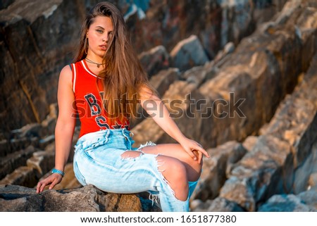 Lifestyle, portrait of a pretty Caucasian girl wearing a red tank top