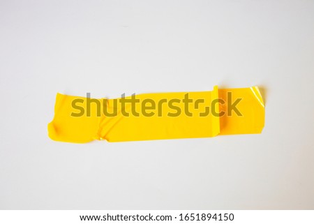 ellow tapes on white background. Torn horizontal and different size yellow sticky tape, adhesive pieces.