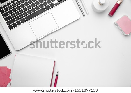 Sheets and devices. Flat lay, mock-up. Feminine home office workspace, copyspace. Inspiring workplace for productivity. Concept of business, fashion, freelance, finance, artwork. Trendy pastel colors.