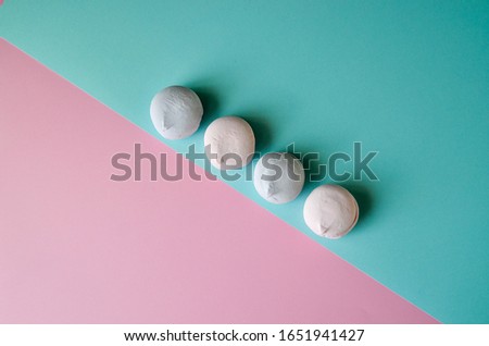 Colorful marshmallows on vibrant background. Pink, purple sweets, candy shop, trendy photography for design, place for text. Confectionery wallpaper