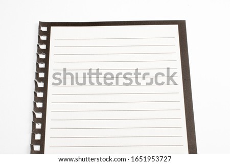 Blank diary sheet with rows on white background, close-up shot with selective focus. reminder, education.