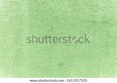Stucco wall texture, abstract background, green color. Stock photo