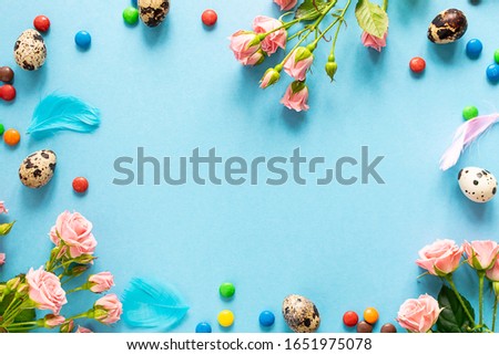 Happy Easter greeting card on trendy blue background with copy space for your text.