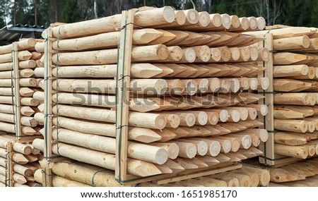 Wooden stakes. Lumber in stock. Ready for loading Royalty-Free Stock Photo #1651985170