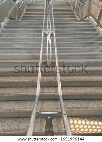 Stairs that are blocked by a railing