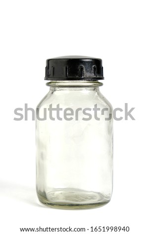 Old, empty bottle of medicine on a white background