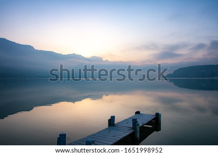 zen moment by the lake of annecy at sunrise