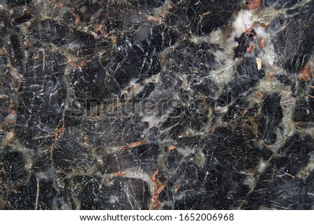 Marble texture. Close-up. The color is dark. View from above