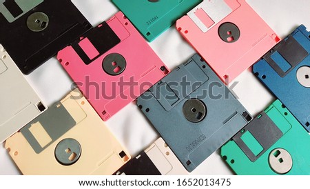 Unique arrangement of colorful floppy disks/diskette as a background or table or wall decoration