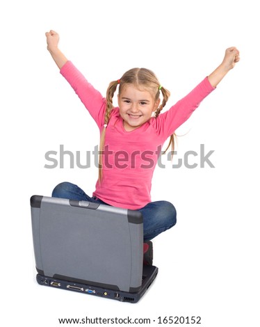happy girl holding hands up for winning computer game or learning a lesson