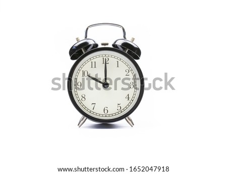 Black vintage alarm clock on a white background shows the time ten hours Royalty-Free Stock Photo #1652047918