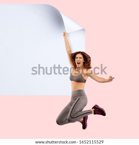 Imagine who's covering white sheet to get digital file icon. Young sportive woman catching the edge of huge paper sheet. Digital world, funny imagination of the way the icon's appearing.