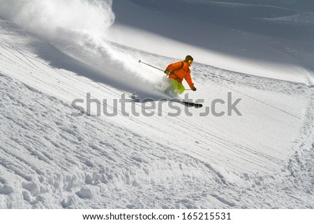 Skier in deep powder, extreme freeride Royalty-Free Stock Photo #165215531