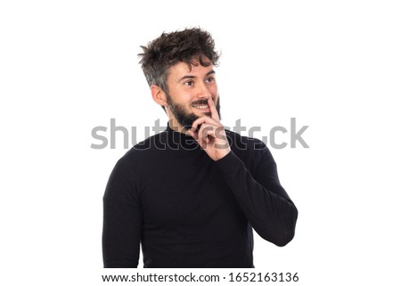 Young man in black isolated on a white background