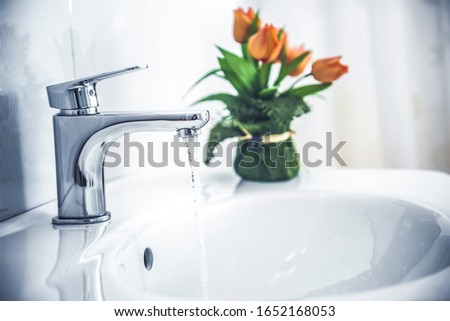 Wash hands with soap under the faucet with water. Hygiene concept. Cleaning hands Water tap with sink.