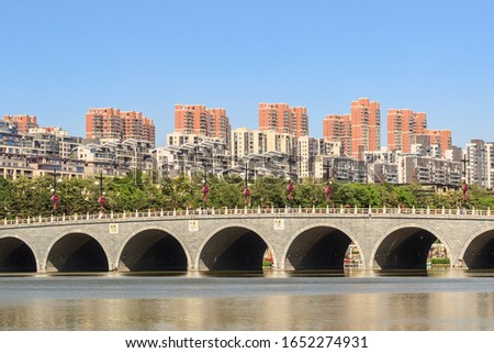 Spring, Shaanxi, China, Xi'an Qujiang pool Ruins Park, sunny and beautiful scenery - the word on the bridge is HuangQuQiao