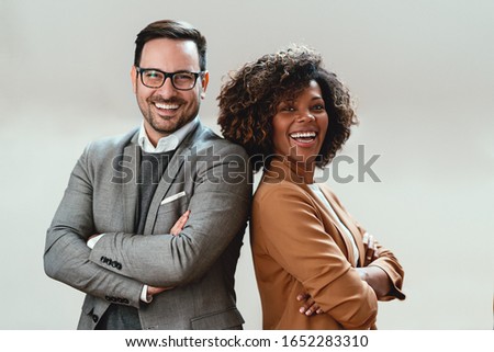 Portrait of multi ethnic business couple Royalty-Free Stock Photo #1652283310