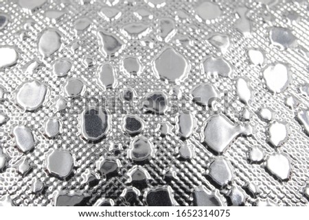 A silver colored textured surface for background