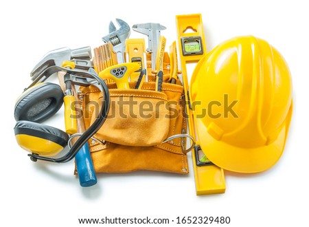 construction tools isolated on white helmet toolbelt earphones and other Royalty-Free Stock Photo #1652329480