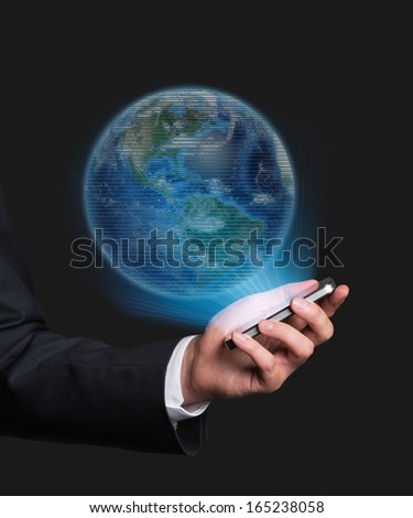 Businessman with globe. Elements of this image furnished by NASA.