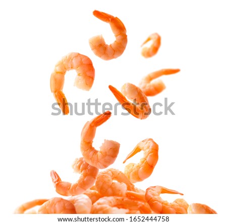 Boiled prawns levitate on a white background Royalty-Free Stock Photo #1652444758