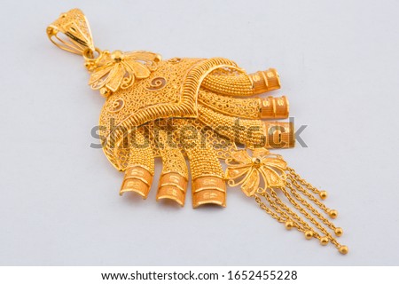 Gold Pendent in Crown angle view isolated in white background Royalty-Free Stock Photo #1652455228