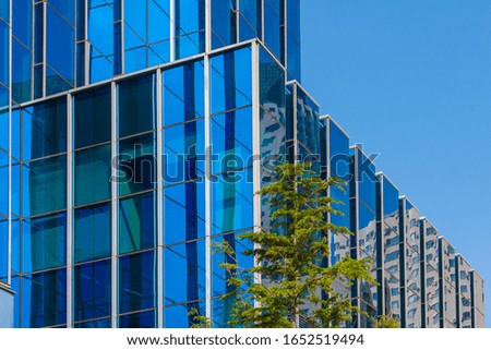 Glass facade of outdoor blue skyscraper
