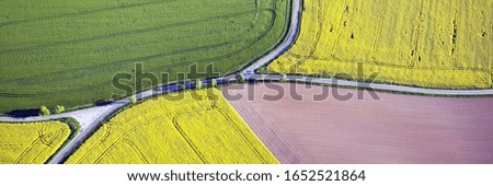 Fields and roads from above. Panoramic aerial view