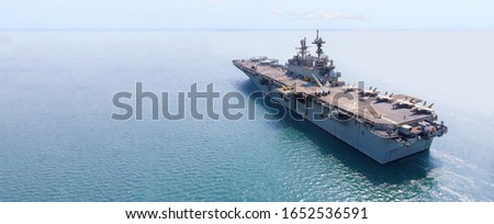 Nuclear ship, Military navy ship carrier full loading fighter jet aircraft and helicopter for patrol. Royalty-Free Stock Photo #1652536591