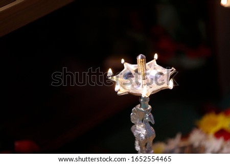 Traditional oil lamp with flame 