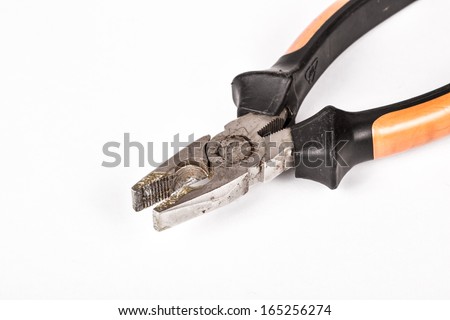 A pictures of a used and aged set of pliers on a white background
