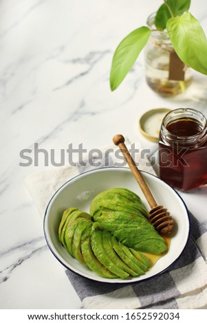 Sliced Ripe Avocado with Honey
