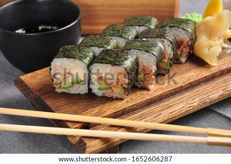 nori seaweed sushi roll with tempura shrimp and cucumber