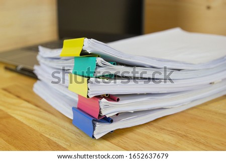file folder and Stack of business report paper file on the table in a work office, concept document in work office